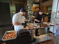 a man wearing a black hat